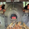 Potters firing wood-kiln